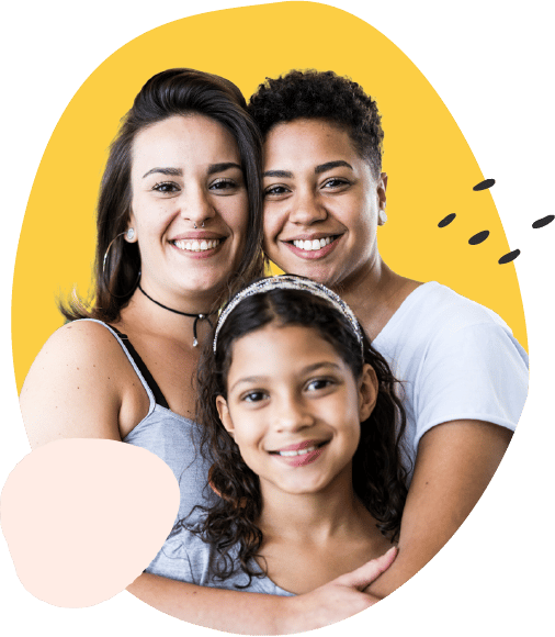 Two woman and a young girl smiling