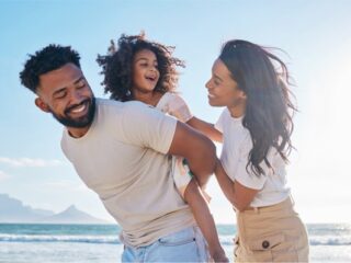 young family on the beach