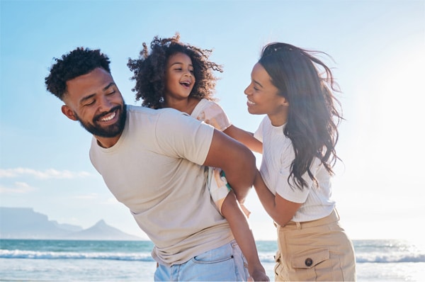 young family on the beach