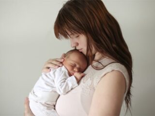 woman holding baby