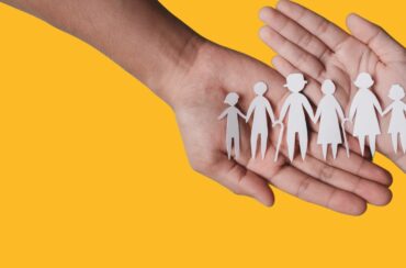 Hands holding a paper family. Copyright: Kiattisak Lamchan via Canva.com