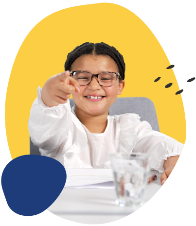 Smiling child with glasses pointing toward the camera while sitting at a desk, with a glass of water in front of them and a bright yellow graphic background.